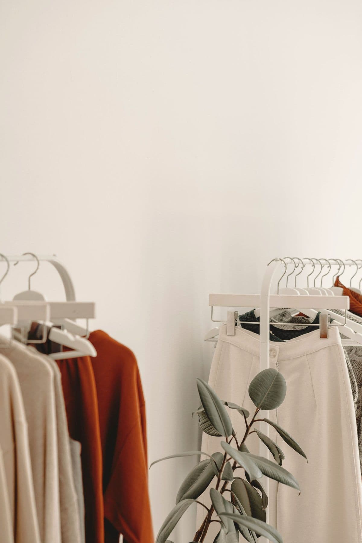 A rail of soft, neutral-toned pieces